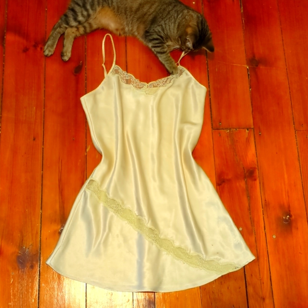 Vintage yellow satin slip dress with lace detailing.